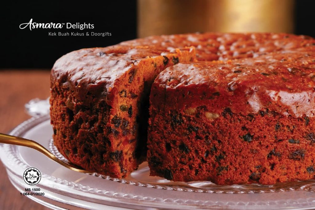Classic steamed fruit cake (kek buah kukus) from Asmara Delights, rich with premium dried fruits and baked to perfection.